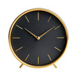 © Maria - Elegant gold and black round clock on a stand showcasing minimalist design for modern home decor