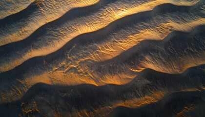 Poster - Aerial shot of the Gobi Desert dunes glowing under the golden light of sunset, with rippling sand patterns creating dramatic shadows, in 4K resolution