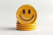 © Desain - Stack of yellow smiley face discs on white background.