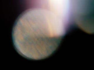 Wall Mural - colorful light leak on dark background. cinematic visual lens effect for design and creative ideas. 