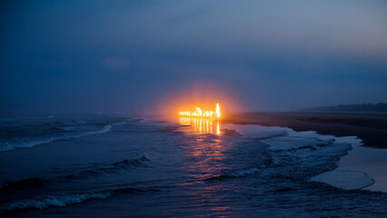 Canvas Print - Generated image, 
A line of glowing fire leading across the ocean to the shore, a misty night.