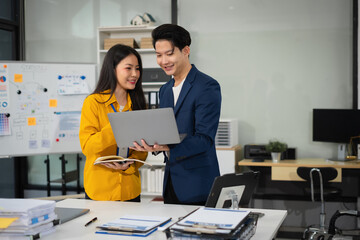 Wall Mural - Asian business people discussing on performance revenue in meeting. businessman working with co-worker team. financial adviser analysing data with investor.