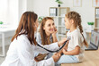 © Studio Romantic - Pediatrician, female pediatrist doctor with stethoscope listening to heart, lungs, child health care in clinic checking up exam, small patient healthcare in hospital for controlling kid developing