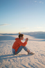 Wall Mural - addicte hipster girl chatting with friends via smartphone ignoring beauty of nature, woman traveler 