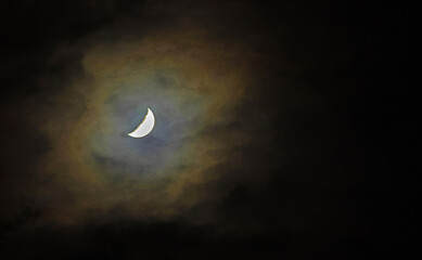 Wall Mural - orange glow from the moon through clouds at night