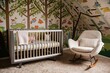 © Hassan - A childs nursery features a whimsical treethemed mural, a modern crib, and a comfortable rocking chair. Soft colors and playful bird designs create a calming atmosphere.