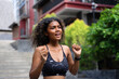 © Suney - Young African woman is exercising in the city.