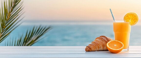 Wall Mural - Ocean view breakfast croissant, orange juice, and oranges.