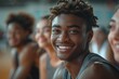© S photographer - Smiling athlete in a gym, showcasing teamwork and camaraderie during a basketball practice session.