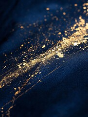 Poster - Gold Splashes and Shimmering Textures on Deep Blue Fabric Create a Captivating Display of Artistic Contrast and Elegance in an Abstract Composition