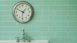 © Chanagun - A stylish and modern bathroom featuring a sleek wall clock and elegant fixtures, set against a soothing mint green tiled background, creating a refreshing atmosphere.