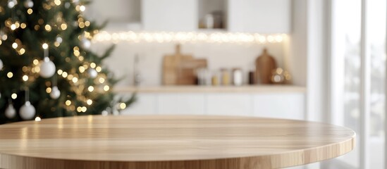 Poster - Circular wooden table in modern kitchen interior with Christmas tree and fairy lights perfect for product display and text placement