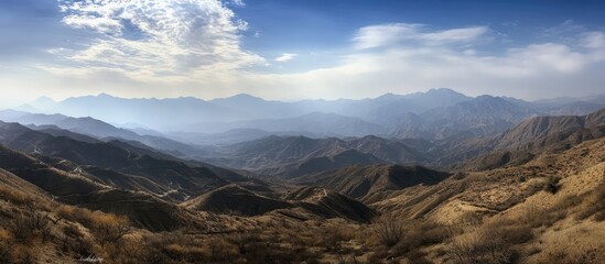 Aufkleber - Breathtaking panoramic landscape of majestic mountains under a vast sky showcasing natural beauty and serene wilderness.