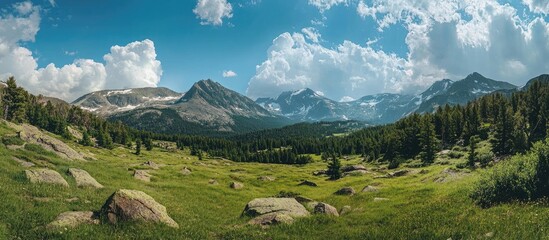 Aufkleber - Vast Mountain Landscape with Lush Greenery under a Dramatic Sky and Majestic Peaks in the Background