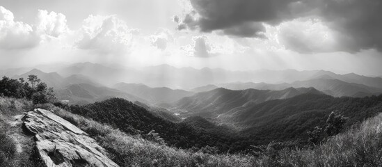 Aufkleber - Stunning black and white panoramic view of majestic mountains under dramatic cloudy skies.