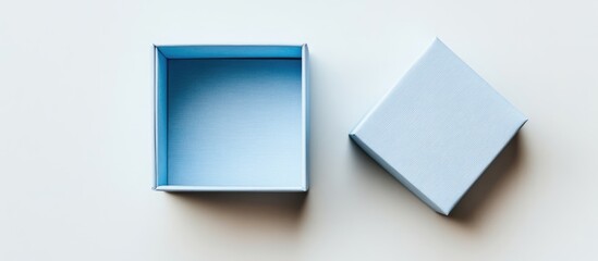 Poster - empty gift box with lid placed beside it on a minimalist white background, ideal for showcasing pack