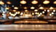 © ole - Empty Wooden Table Top with Blurred Background of Restaurant Lighting and Atmosphere