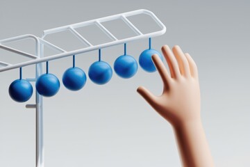 Leinwandbilder - A hand reaches for blue spheres hanging from a white structure, suggesting interaction or choice.