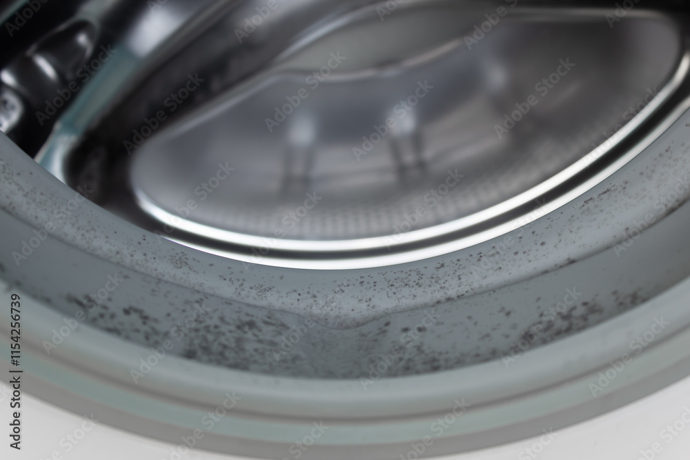 Closeup image of dirty moldy washing machine, mold in the cuff ...