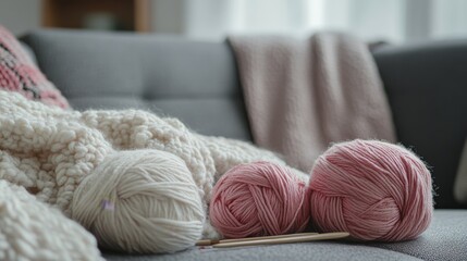 Aufkleber - An intricate knitting setup in a cozy living room, Yarn and knitting needles neatly placed on a sofa, Minimalist indoor style