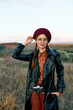© SHOTPRIME STUDIO - Stylish woman capturing memories with vintage camera on a sunny day in the park