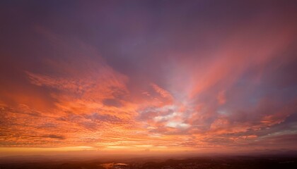 Wall Mural - orange and pink historical past autumn or fall heat hues in blurred cloudy sky example dawn or sunse
