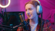 © Yuliia - Cyber sport gamer teen girl female player radio host streamer broadcaster blogger influencer podcast streaming esport play computer video game gaming content happy woman in headphones talk microphone