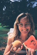 © Franci Leoncio - Tourist smiling and holding arancino and watermelon slice in italy
