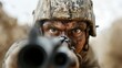 © JoxyAimages - The soldier fiercely aims his weapon, eyes locked on the target, emphasizing his determination and focus, highlighted by the dirt-covered face and gear.
