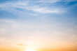 © ISENGARD - Sky,sunset, beautiful , luxury soft gradient orange gold clouds and sunlight on the blue sky perfect for the background, Sunrise on morning or everning in winter warm time ,Twilight summer,silhouette