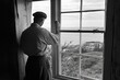 © Hafiz - Lighthouse keeper cleaning windows, New England coastline, 1950s working life