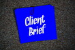 © may1985 - Client Brief text message on stick note on cork paper background
