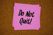© may1985 - Do Not Quit! text message on stick note on cork paper background