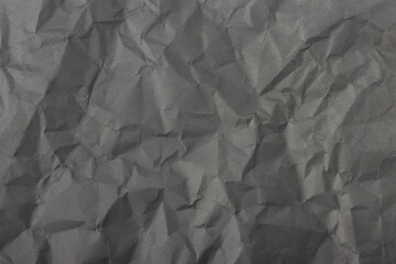 Abstract dark gray crumpled paper texture background