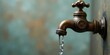 © vattana - Antique Faucet with Water Flowing, a Close-Up Image Showing Intricate Details and a Rustic Background