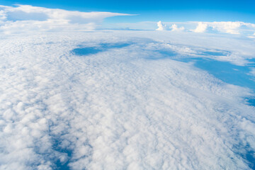 Wall Mural - Blue Sky with Fluffy White Clouds on a Sunny Summer Day. Cloudscape - Blue sky and white clouds. Background cloud summer. Sky cloud clear with sunset. Natural sky