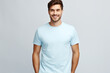 © jeewanthisandalanka - A Stylish T-Shirt Advertising Mockup: Young Man Model Wearing a Short Sleeve Light Blue T-Shirt
