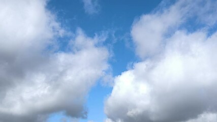 Wall Mural - large radiant cumulus clouds moving across the sky
