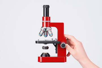 Poster - close up of hand holding red microscope, showcasing its detailed features and lenses, perfect for sc