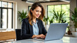 © Viraj - Businesswoman at Work: Confident Woman Using Laptop in Office