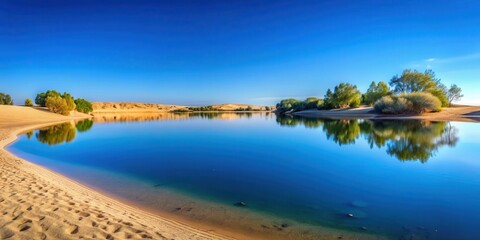 Wall Mural - Tranquil sandy landscape with serene blue lake reflecting the clear sky , peaceful, water, nature, calm, reflection, serene