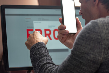 Poster - Angry man having computer app crash error calling to tech support. Close-up from behind of a man facing a computer error, displaying a range of emotions while reviewing critical data on the screen