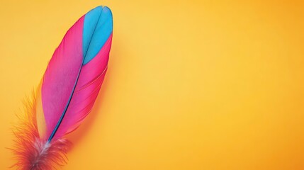 Wall Mural - Vibrant pink and blue feather on yellow background.