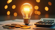 © Ai_Stock - A light bulb, a pen, a calculator, and copper euro cent coins lie on top of an electricity bill.