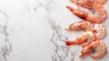 Fresh pink shrimps on marble background.