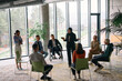 © .shock - Corporate business team meeting with a manager or coach. Group of happy diverse, multiracial people sitting in a circle
