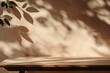 © firdan - Background for branding products, cosmetics, food or jewellery presentation. Empty table on bright brown wall background. Composition with leaves shadow and beautiful light on the wall.