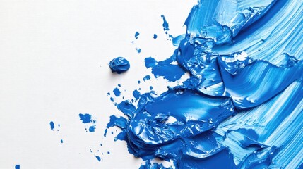 Poster - Blue oil paint smear on a white canvas background showcasing vibrant texture and color blending for artistic design or background use
