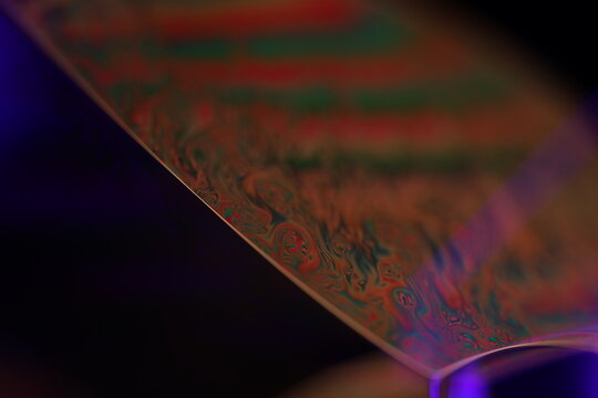 Green liquid edge on the dark background, colourful abstract, green shapes, minimalism, line of light, black and green