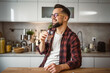 © Miljan Živković - Portrait of handsome man with beard and eyeglasses drink water